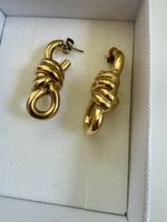 Guess Ohrringe im Knoten-Design