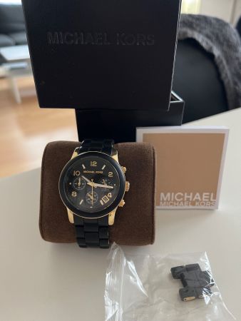 Montre Michael Kors femme noire et or, pile neuve