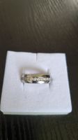 Ring,silberfarbig, mit Zirkoniasteinen Reihe Grösse 60