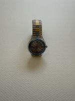 Montre Swatch Autoquartz bicolore etat utilisee