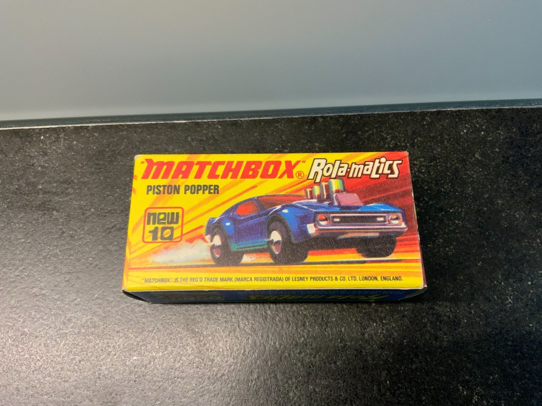Matchbox Modellini d'auto: MATCHBOX Rola-matics Nr.10, PISTON POPPER – Nuovo e nell'imballaggio originale da Erlenbach im Simmental venduto da Model_box 5
