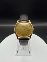 Montre Orano NOS Suisse tonneau plaqué or 70s ultra fine