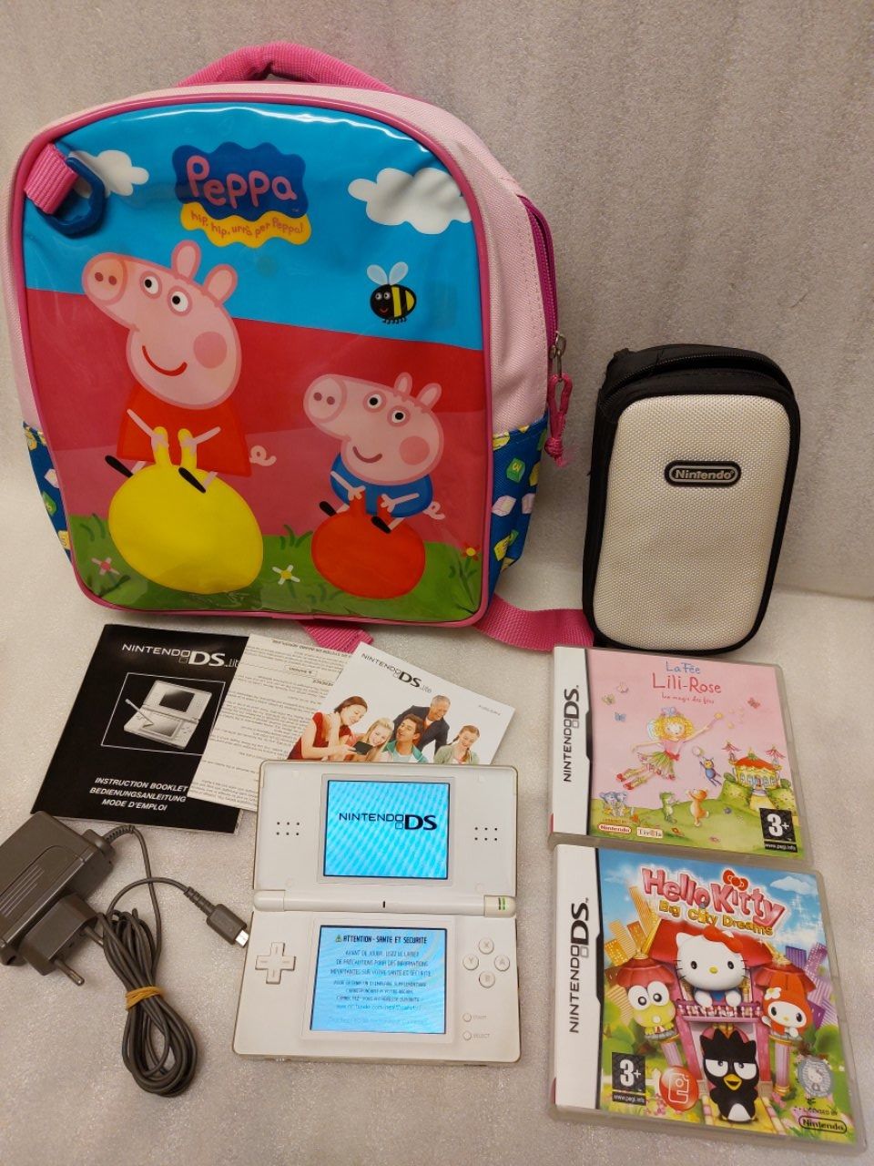 Nintendo Console: Consolle Nintendo DSi + 2 Game + Sac PEPPA PIG – Usato da Pambio Noranco venduto da Pol69