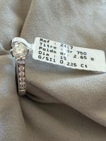 1 solitaire en or gris avec diamant