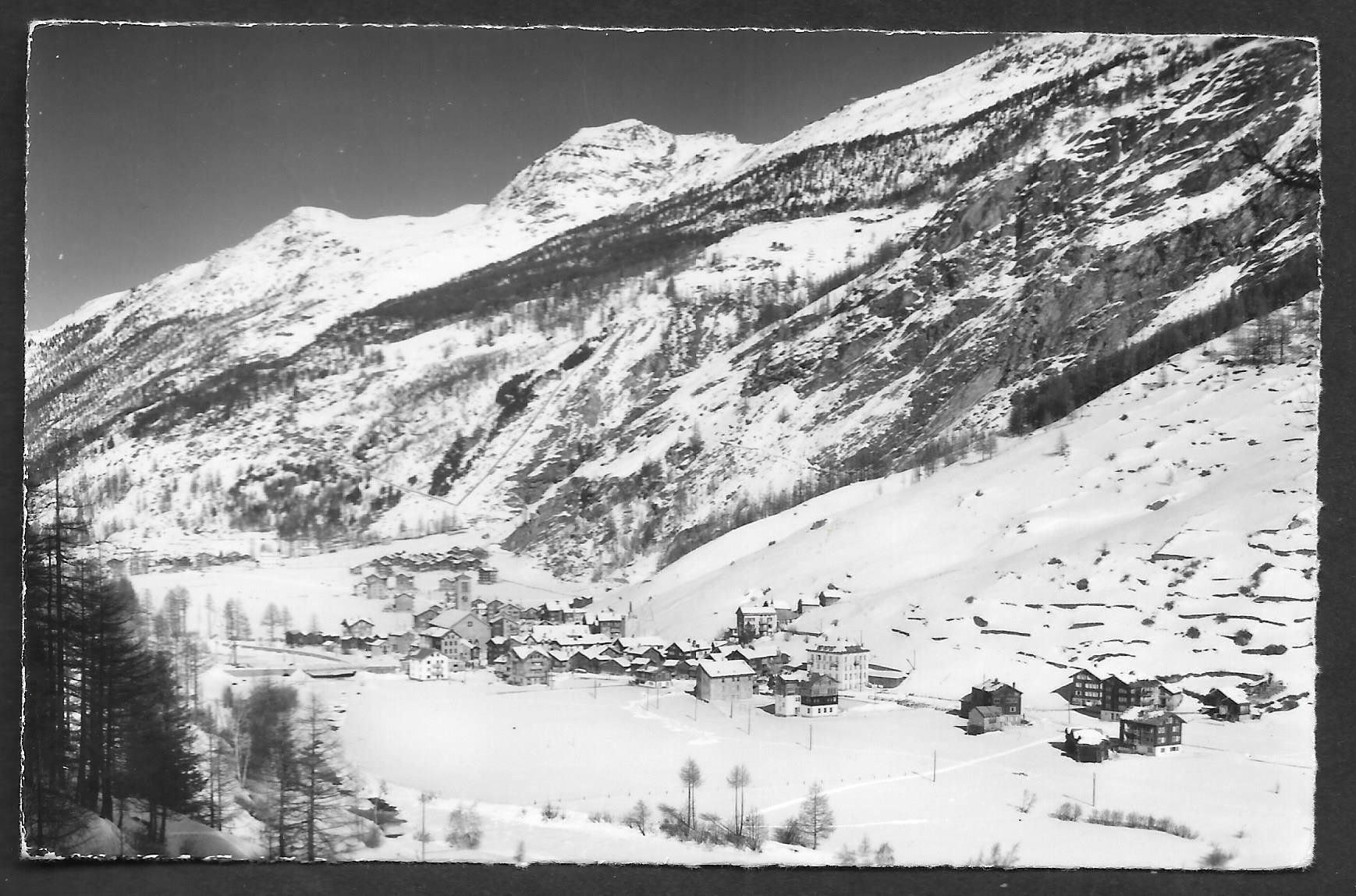 Cartoline postali: Saas-Grund Dorfansicht im Winter – Usato da Olten venduto da clotaldi