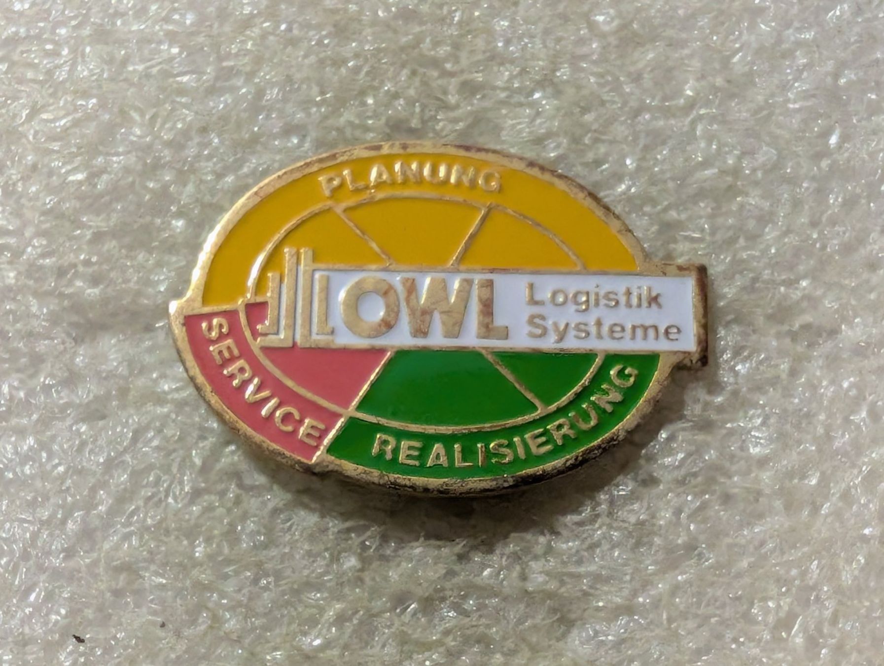 Plaketten & Abzeichen: Ansteckpin 171: OWL Logistik – Gebraucht aus Oppligen von Pin-Fall-Shop