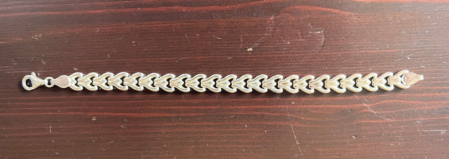 Bracelets: Bracelet en argent décorée en suite de coeurs – D'occasion à Genève par Donnet2