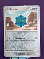 Bronzor - Reverse Holo - Pokemon Surging Sparks