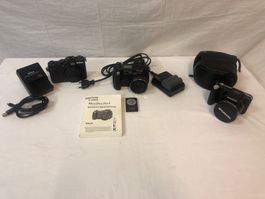 Drei Kompaktkameras; Olympus, Nikon und eine Canon