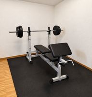Hantelbank mit 75 kg Gewichten