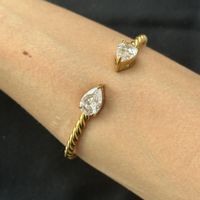 18KGP Tropfen Zirkonia Goldene Armreif
