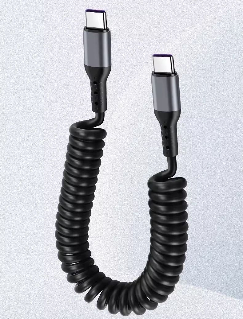 Caricabatterie: Câble USB-C spiralé à charge rapide 80W max. – Nuovo e nell'imballaggio originale da Morges venduto da DigiAC