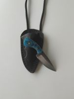 Handgefertigtes Kettenmesser mit Scheide.