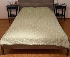 Double bed with wooden frame and headboard, disassembled