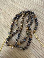 Facettierte Tigerauge Perlen à 4 mm neu