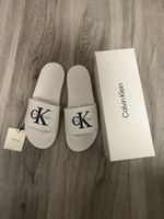 Mules Calvin Klein blanches avec logo noir taille 41
