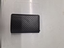 Porte-cartes homme noir carbone neuf et élégant.