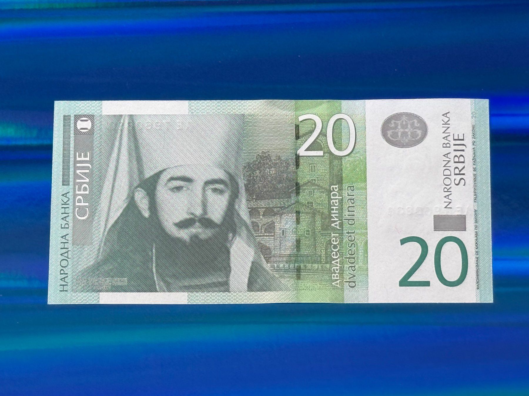 Banconote: Belgrad 2006 - Serbien - 20 Dinara UNC – Nuovo e nell'imballaggio originale da Pfäffikon SZ venduto da Sieben77