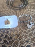 Bracelet Christian Dior avec charms, état d'occasion