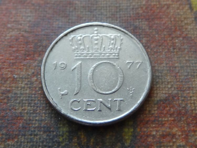 Tutti le monete: PAYS-BAS  Nederland  10  Cent  1977 – Usato da Romanel-sur-Lausanne venduto da Swift13