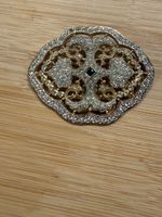 Brosche goldfarben mit Stein