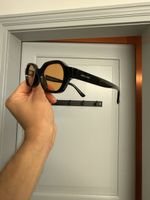 Sonnenbrille Meller schwarz orange Gläser neu