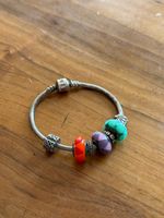 Pandora silver bracelet with murano glass charms.