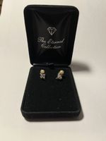 Earrings with floral motive and pearl
