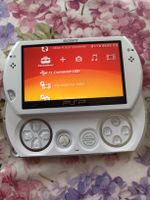  PSP   GO SONY blanche état excellent avec chargeur et jeux 