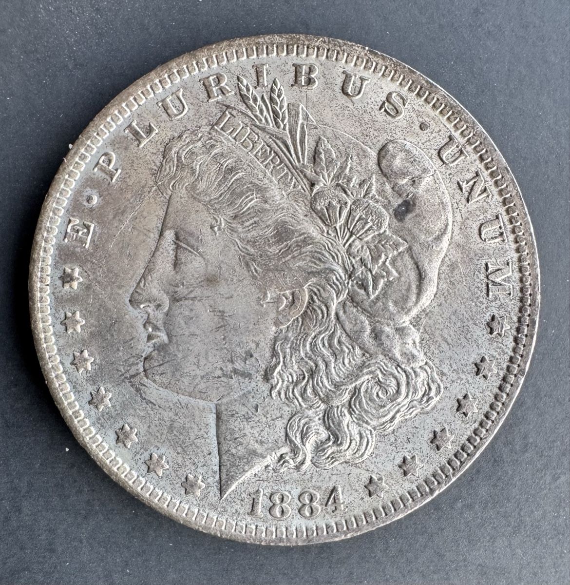 Alle Münzen: 1 Morgan Dollar 1884 O – Gebraucht aus Meilen von coins4sale