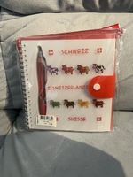 Notizblock Switzerland und Kugelschreiber