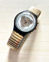 Swatch Chronograph, schwarzes Gehäuse,goldfarbenes Band