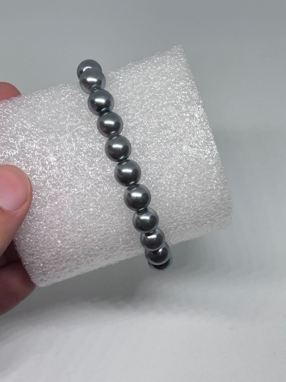 Bracciali & Braccialetti: Bracciale elastico con perle sintetiche grigio antracite – Usato da Giubiasco venduto da LorisVale 1