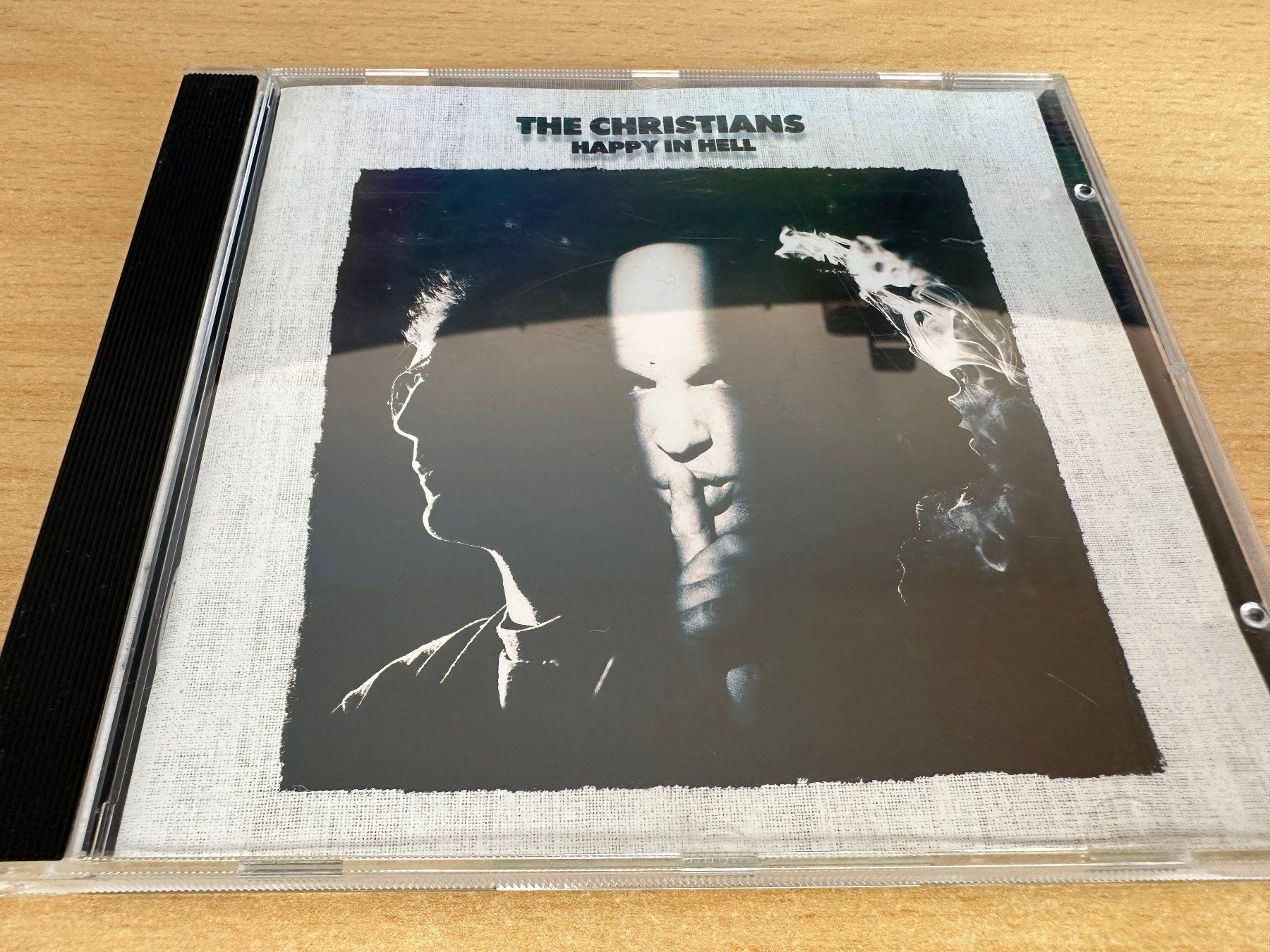 CD: The Christians – Happy In Hell – Usato da Rikon im Tösstal venduto da Alpenmutz