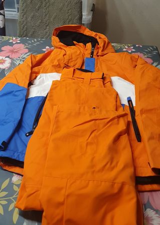 Combinaison de ski orange et bleu, taille enfant