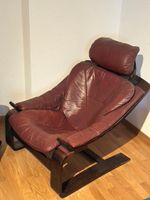 Vintage Ledersessel mit Holzgestell – bequem und zeitlos
