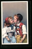 Zwei süsse Appenzeller Kinder küssen s