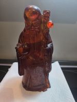 Figur Figur aus Bernstein mit Stab und Pfirsich antik