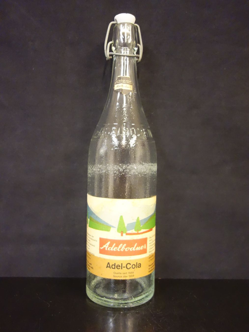 Bicchieri, Caraffe & Bottiglie: alte Flasche ADELBODNER ADEL - COLA 1965 – Usato da Kerzers venduto da Flaschenposten