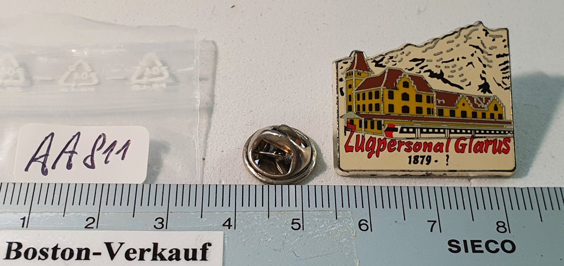 Placchette & Badge: AA811 - Pin Zugpersonal Glarus 1879 - ? – Usato da Reinach BL venduto da Boston-Verkauf 1