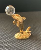 süsse golfarbene Delfinfigur mit Kristall