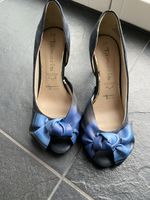 Suede open toe pumps