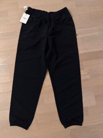 Black TNA trousers - new, size M