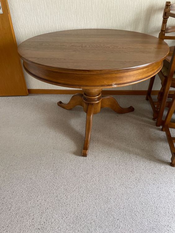 Ensemble table ronde en teck et 6 fauteuils en teck et corde