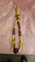Collana di stoffa con perline