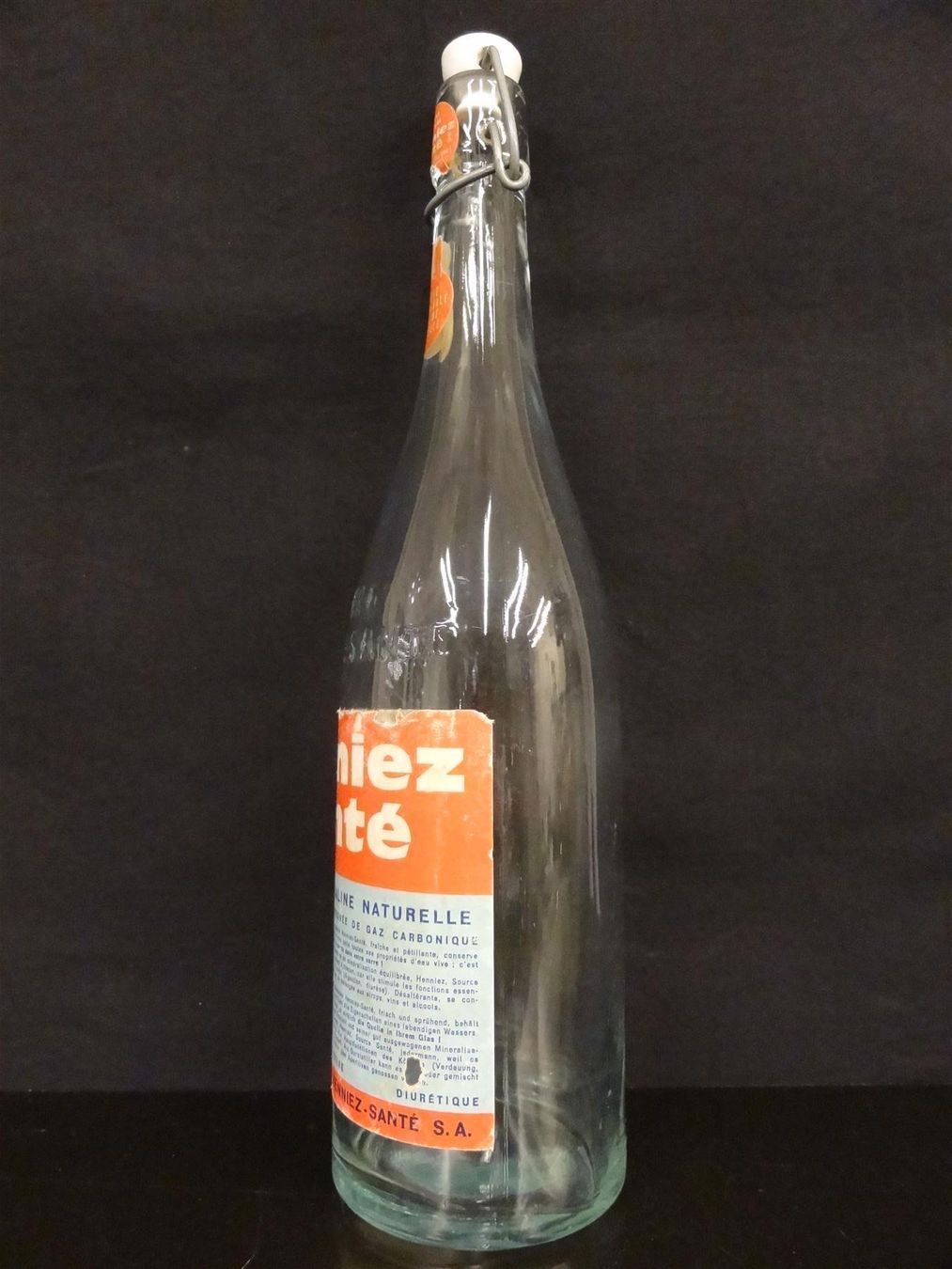 Bicchieri, Caraffe & Bottiglie: alte Flasche HENNIEZ SANTÉ – Usato da Kerzers venduto da Flaschenposten 8