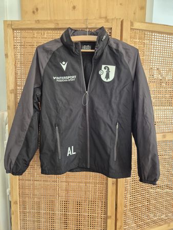 Macron Sportjacke Team Basel schwarz Grösse JR L-XS