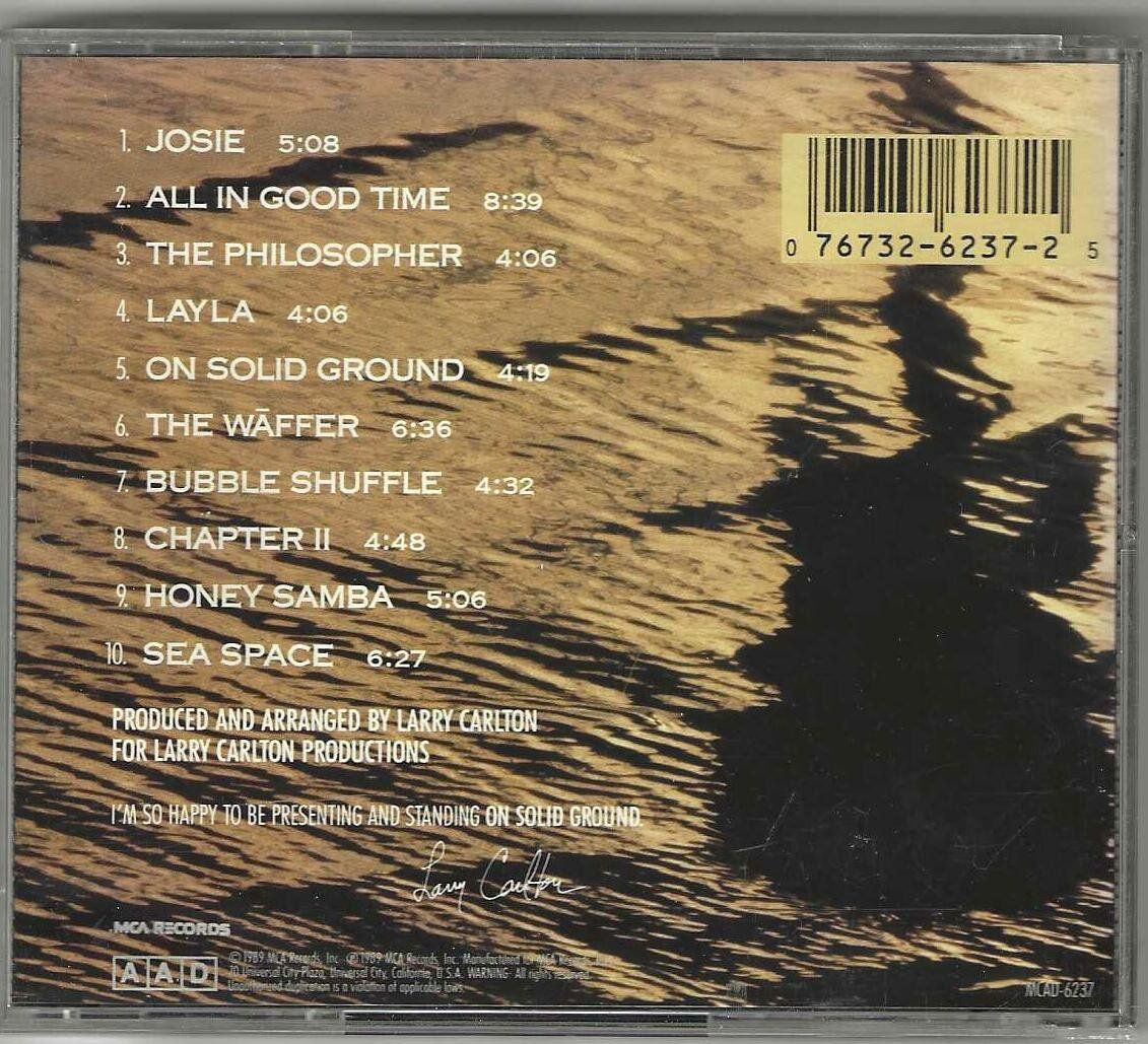 CD: Larry Carlton – On Solid Ground – Usato da Genève venduto da CDLPBookS 1