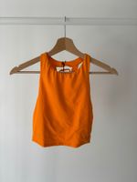 Top de sport orange vif, dos lacé - idéal pour l'été!