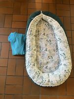 Babynest grün mit Blumenmuster neuwertiger Zustand